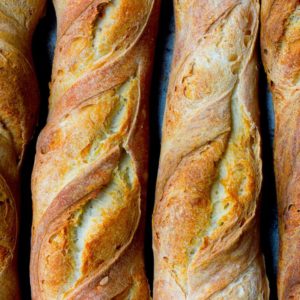 Crispy warm golden brown baguettes with twists